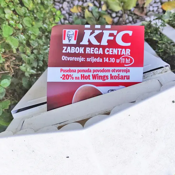A KFC restaurant-opening flyer in a mailbox